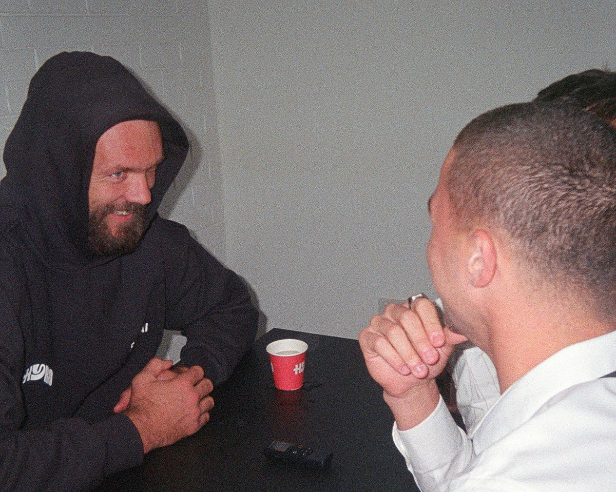 Max Gawn in a Hyro hoodie with a Hyro cup