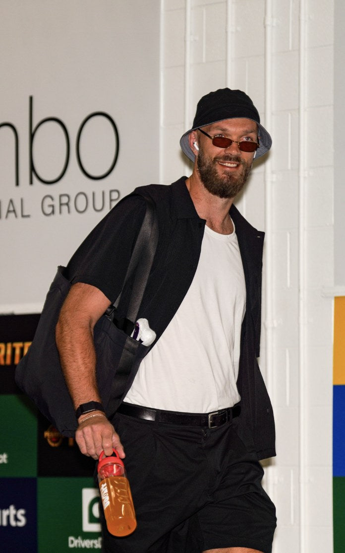 Max Gawn arriving with a Hyro bottle