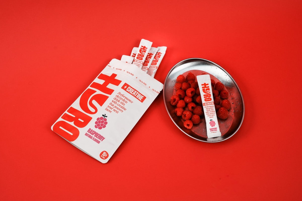 Hyro Raspberry Electrolytes + Creatine pouch with 5g-creatine sticks fanned out